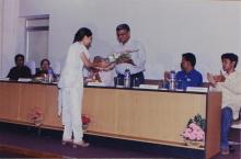 Prof. V. G. Idichandy receives a bouquet of flowers from a student at the inauguration of Saarang, 2005
