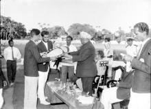 Dr. A. L. Mudaliar presents a trophy shield to a student at the Third Inter-IIT Sports Meet, 1964