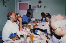 A discussion over refreshments, 2003