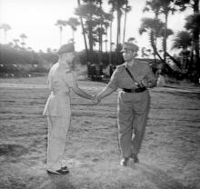 Major General Virendra Singh shakes hands with an officer, 1965