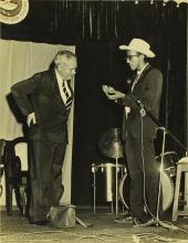 Mr. Gopal Ramachandran performs a magic trick as volunteer Prof. W. Koch watches, 1966