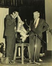 Mr. Gopal Ramachandran performs a magic trick as volunteer Prof. W. Koch watches, 1966