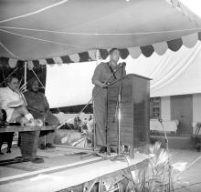 An officer addresses the audience during the inauguration of the new NCC building, 1965
