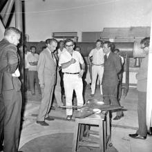 Prof. Armin Klein addresses the group at a wind tunnel in the Applied Mechanics Department, 1969