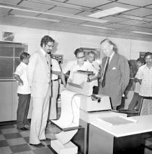 Dr. h. c. Heinrich Luebke taking a look at the equipment in a laboratory