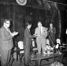 Prof. A. Ramachandran presenting a magazine to Dr. Karl Pfauter at the Ninth Institute Day celebrations at the Open Air Theatre, 1968