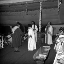 A student shakes hands with Mrs. Indira Gandhi, the chief guest of the eleventh convocation, before receiving his prize