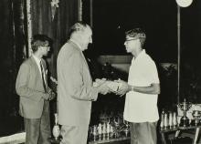 Dr. Karl Pfauter giving away a prize to a student at the Ninth Institute Day celebrations at the Open Air Theatre, 1968