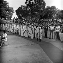 The academic procession enters the Open Air Theatre