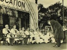 A graduate bows to the dignitaries after receiving his degree  