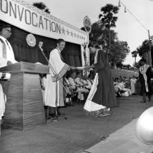 A graduate receives her degree from Prof. A. Ramachandran 