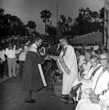 A prize winner receives his award from the chief guest of the eighth convocation, Prof. M. G. K. Menon