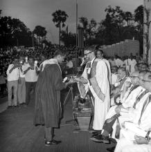 A prize winner receives his award from the chief guest of the eighth convocation, Prof. M. G. K. Menon
