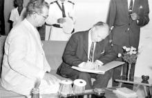 Mr. Walter Scheel signs the visitor’s book, 1963