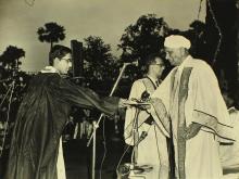 A student receives an award from Sir C. V. Raman