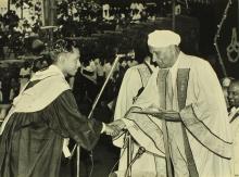 A student receives an award from Sir C. V. Raman