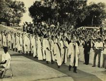 The academic procession enters the Open Air Theatre