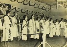 The dignitaries stand for the invocation before the commencement of the convocation ceremony