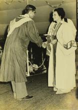 A student shakes hands with Mrs. Indira Gandhi, the chief guest of the eleventh convocation, before receiving his prize