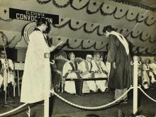 A student bows to the chief guest, Mrs. Indira Gandhi, before receiving his degree from  Prof. K. A. V. Pandalai 