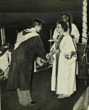 A student shakes hands with Mrs. Indira Gandhi (Prime Minister of India), the chief guest of the eleventh convocation, before receiving his prize