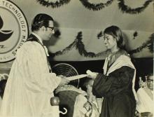 A student receives her degree from Prof. K. A. V. Pandalai 