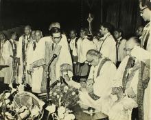 Mr. P. N. Haksar signs the register of degrees at the 12th Convocation, 1975