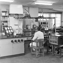 Mr. Vasudevan operating a machine at the electrical engineering laboratory