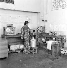 A laboratory attendant or student with equipment