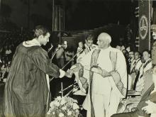 A student receives his award from the chief guest, Dr. V. V. Giri  