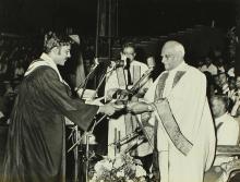 A students receives his award from the chief guest  Dr. V. V. Giri 