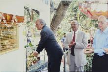 Prof. A. Ramachandran unfurls the flag to reveal the plaque at the Heritage Centre, 2006