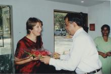 Prof. Ajit Kumar Kolar greets a delegate with a bouquet at the Heritage Centre, 2006