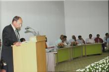 A speaker addresses an audience at IIT Madras