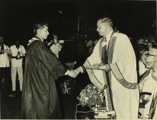 A student receives an award from Mr. H. V. R. Iengar 