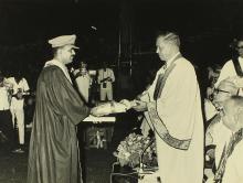 A student (possibly) receives an award from Mr. H. V. R. Iengar