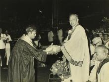 A student receives an award from Mr. H. V. R. Iengar 