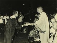 A student receives an award from Mr. H. V. R. Iengar 