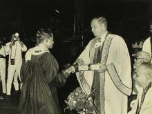 A student receives an award from Mr. H. V. R. Iengar 