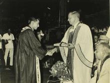 A student receives an award from Mr. H. V. R. Iengar 