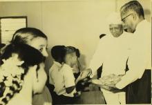 Dr. A. L. Mudaliar and Mr. Y. S. Ramaswamy distribute refreshments to the students of Central School, 1965