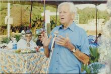 Mr. Gerhard Fischer addresses an audience at a basketball tournament, 2005