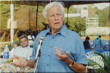 Mr. Gerhard Fischer addresses an audience at a basketball tournament, 2005