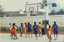 Hustling for a rebound during a basketball match, 2005