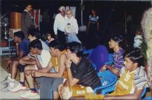 Members of a basketball team look on during a match, 2005