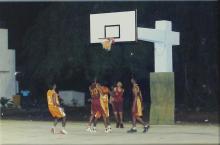 A basketball player makes a shot during a match, 2005