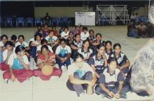 Basketball players seated on a basketball court at IIT Madras, 2005