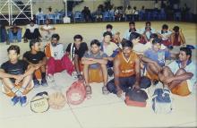 Basketball players sitting on a basketball court at IIT Madras, 2005