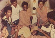 Enjoying a lighter moment on a train, 1985