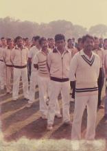 A cricket team photographed at the 22nd Inter-IIT Sports Meet, 1985
